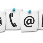 Ikony telefonu i e-mail symbolizujące kontakt.